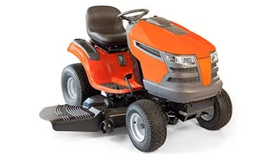 Orange and gray riding lawn mower with a black seat and steering wheel on a white background