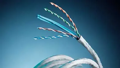 Close-up of a stripped white Ethernet cable, its four twisted, colored wire pairs fanned out against a blue background.