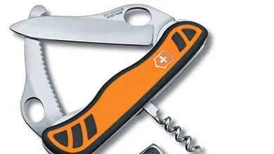 A Victorinox Swiss Army knife with an orange and black textured handle, shown open with a large blade, a serrated blade, and a corkscrew extended.